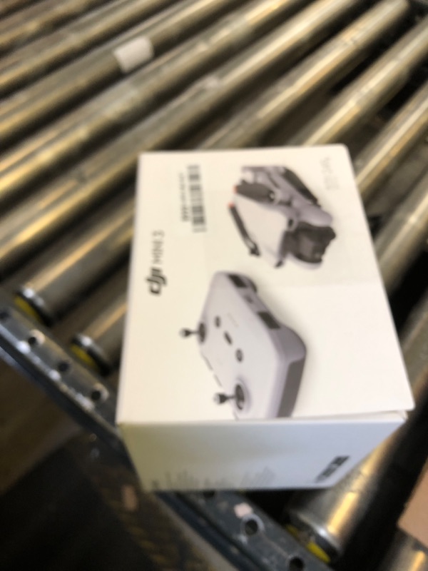 Photo 1 of DJI Mini 3 - Lightweight and Foldable Mini Camera Drone with 4K HDR Video, 38-min Flight Time, True Vertical Shooting, and Intelligent Features controller only 