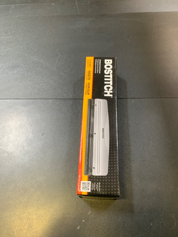 Photo 1 of Bostitch Office Premium 3 Hole Punch, 12 Sheet Capacity, Metal, Rubber Base, Easy-Clean Tray, Silver
