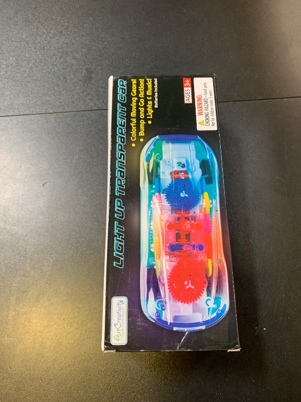 Photo 1 of ArtCreativity Light Up Transparent Sensory Car Toy for Kids, 1PC, Bump and Go Toy Car with Colorful Moving Gears, Music, and LED Effects, Easter Toys for Toddlers, Great Birthday Gift Idea