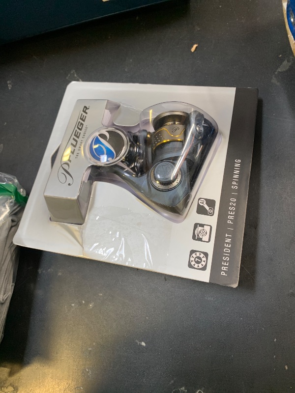 Photo 1 of Pflueger President Spinning Fishing Reel, Size 20, 7 Stainless Steel Ball Bearing System, Sealed Oil Felt Front Drag, Lightweight Graphite Construction