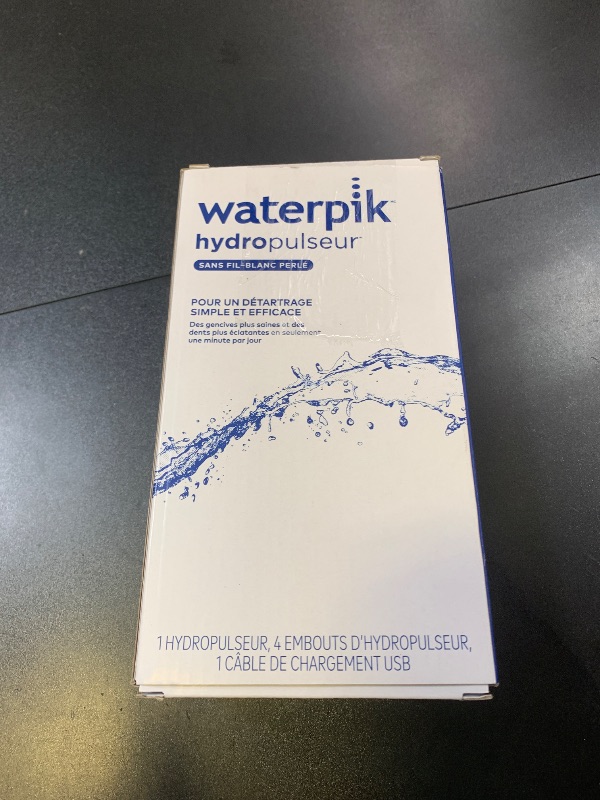 Photo 1 of Waterpik Cordless Pearl Rechargeable Portable Water Flosser for Teeth, Gums, Braces Care and Travel with 4 Flossing Tips - ADA Accepted, WF-13 White, Packaging May Vary