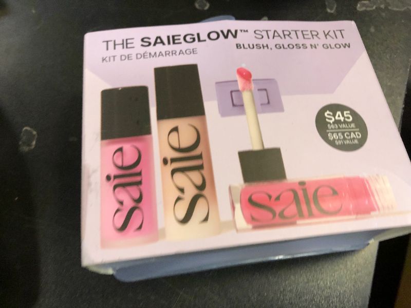 Photo 1 of Saie SaieGlow Starter Makeup Kit - Glowy Super Gel in Roseglow, Dew Blush in Baby, and Glossybounce Lip Gloss in Play - Summer Essentials Makeup Set in a Mini Reusable Jelly Travel Bag (3 Count)