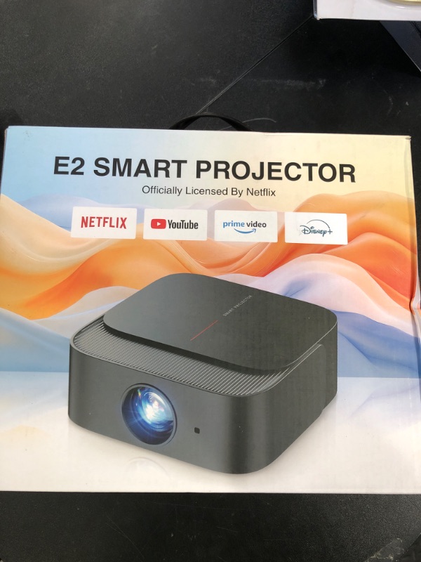 Photo 1 of [2025 Netflix-Licensed | 386+ Built-in Apps] DBPOWER E2 Smart Projector with WiFi and Bluetooth, Mini Projector 4K Support with Netflix, Youtube, Disney+, Hulu, Max, Crunchyroll w Portable Case