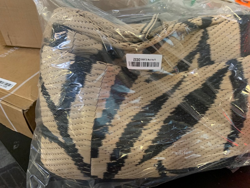 Photo 1 of OLANLY Waterproof Outdoor Rug 5x8 ft, Reversible Outdoor Plastic Straw Rug with Leaf Pattern, RV Mat, Indoor Outdoor Carpet for Patio, Camping, Balcony, Deck, Backyard, Black & Beige