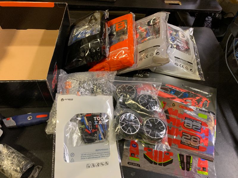 Photo 1 of OWNONE 1 Remote Control Super Car Building Kits, 1835PCS Technique Plated Race Car Building Set for Adults Men Teens - with 5 Fast Motors, Electric Height Adjustment & Drift Spin Wheels