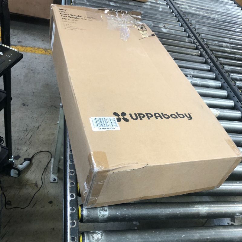 Photo 1 of UPPAbaby Mira Bouncer/Portable 2-in-1 Bouncer + Seat Grows with Your Baby/GREENGuard® Gold, JPMA + FSC® Certified/Cozy Seat Liner + Storage Bag Included/Wells (Taupe Mélange/Black Chrome/Walnut Wood)