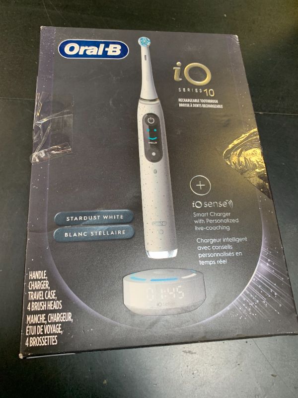 Photo 1 of Oral-B iO Series 10 Rechargeable Electric Toothbrush with Visible Pressure Sensor to Protect Gums, 2 Min Timer, 7 Cleaning Settings, 4 Replacement Toothbrush Heads, and Charging Travel Case, White