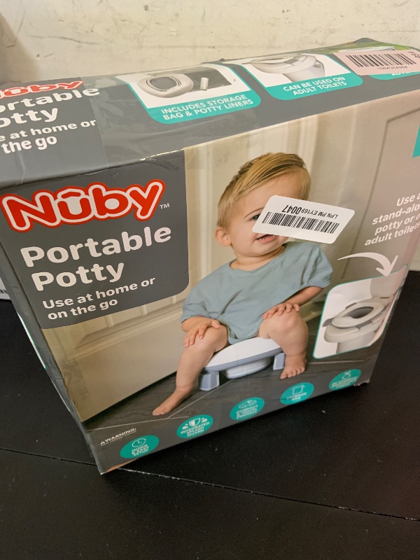 Photo 1 of Nuby On-The-Go Portable Potty Seat - Travel Toilet Seat for Boys and Girls 18+ Months - Includes Storage Bag and Disposable Potty Liners - Toddler Travel Essentials - Toddler Potty Training Toilet