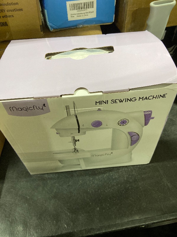 Photo 1 of Magicfly Mini Sewing Machine with Extension Table, Dual Speed Portable Sewing Machine for Beginners with Light, Sewing Kit for Household Use, White