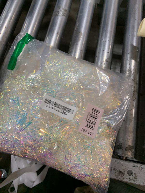 Photo 1 of YOOGCORETT 36 FT Christmas Tinsel Garland Glitter Tinsel Streamers for Classic Christmas Tree Decorations Wedding Holiday Party Indoor and Outdoor Decorations Supplies (Iridescent)