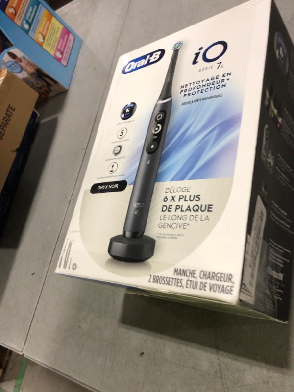 Photo 1 of Oral-B iO Deep Clean + Protect Rechargeable Electric Toothbrush, Black with a iO Series 7 Toothbrush, 2 Replacement Brush Heads, and a Charging Travel Case