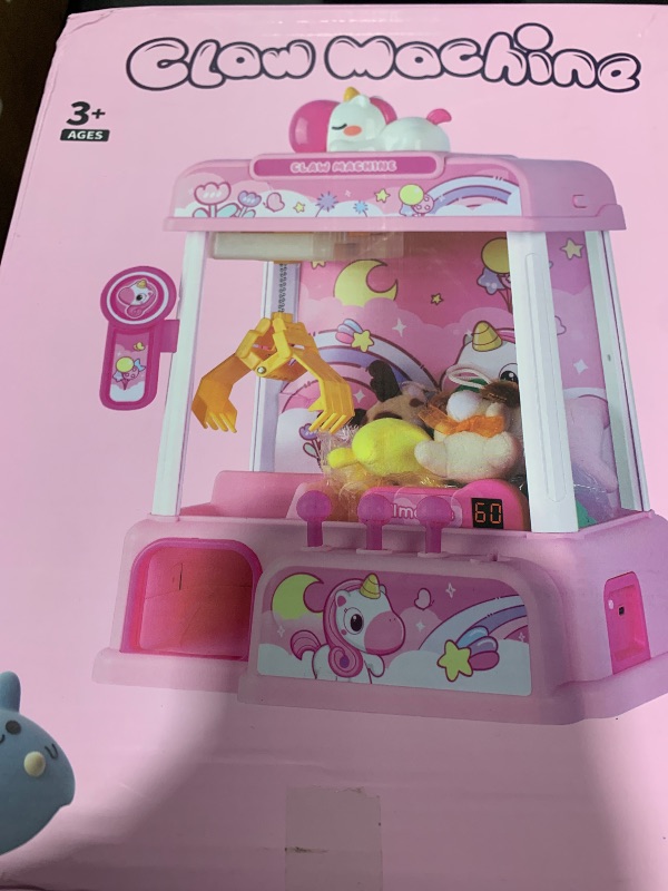 Photo 1 of CWLAKON Claw Machine for Kids, Mini Vending Machine Girls Unicorn Toys with Sound & 20 Mini Toys, Candy Grabber Prize Dispenser Machine Electronic Arcade Games, Christmas Birthday Gifts, Pink