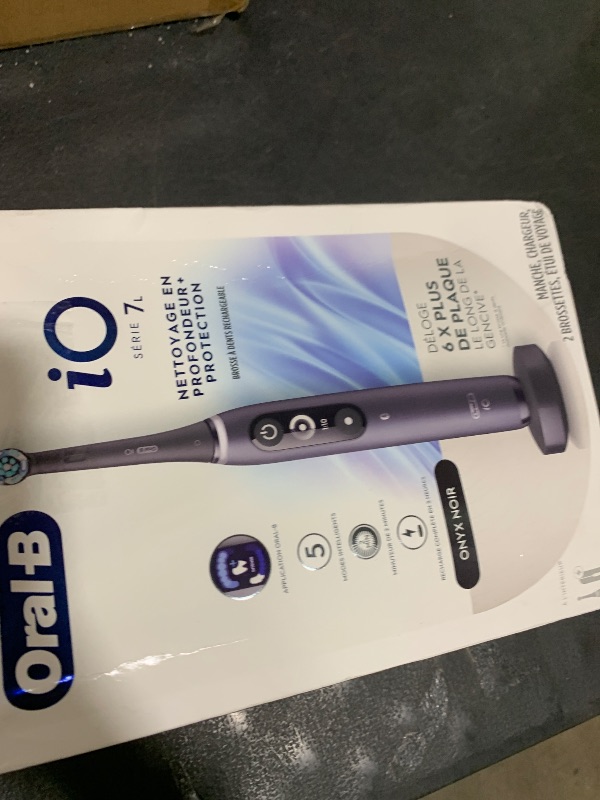 Photo 1 of Oral-B iO Deep Clean + Protect Rechargeable Electric Toothbrush, Black with a iO Series 7 Toothbrush, 2 Replacement Brush Heads, and a Charging Travel Case