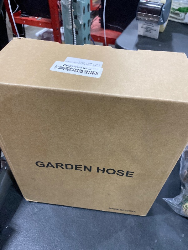 Photo 1 of Non-Expandable Garden Hose 100feet, Flexible Water Hose with 10 Function Hose Nozzle, Lightweight, Tangle Free, Rust Proof for Yard (Black)