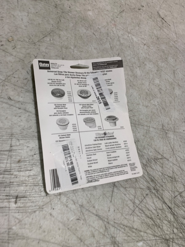 Photo 1 of Oatey 4-1/4 in. Carded White Plastic Snap-Tite Strainer