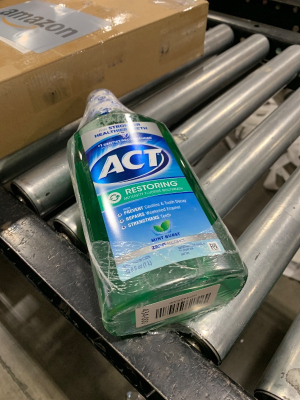 Photo 1 of ACT Restoring Zero Alcohol Fluoride Mouthwash 33.8 fl. oz. Strengthens Tooth Enamel, Mint Burst