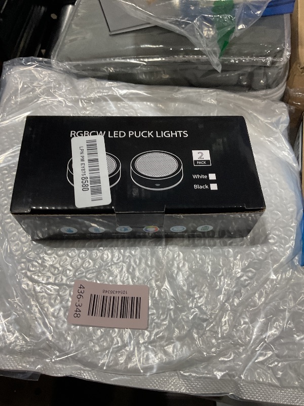 Photo 1 of Puck Lights with Remote Timer, Under Cabinet Kitchen Lights Battery Operated LED Lights, Stick on Shelf Lights Wireless Counter Lights, RGB Color Changing Display Lights, 2 Pack Black