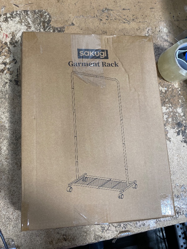 Photo 1 of **MISSING ASSEMBLY HARDWARE** Sakugi Clothes Rack - Clothing Rack with Storage Mesh Shelf & Casters, Heavy-Duty Metal Clothing Rack for Hanging Clothes, Dresses, Coats, Large Load Capacity, Easy Assembly, Black, 28.0"x16.9"x59.0"
