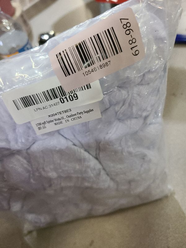 Photo 1 of 1700 sqft Spider Webs Halloween Decorations Bonus with 150 Fake Spiders, Super Stretch Cobwebs for Halloween Indoor and Outdoor Party Supplies