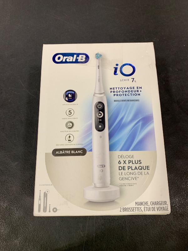 Photo 1 of Oral-B iO Deep Clean + Protect Rechargeable Electric Toothbrush, White with a iO Series 7 Toothbrush, 2 Replacement Brush Heads, and a Charging Travel Case