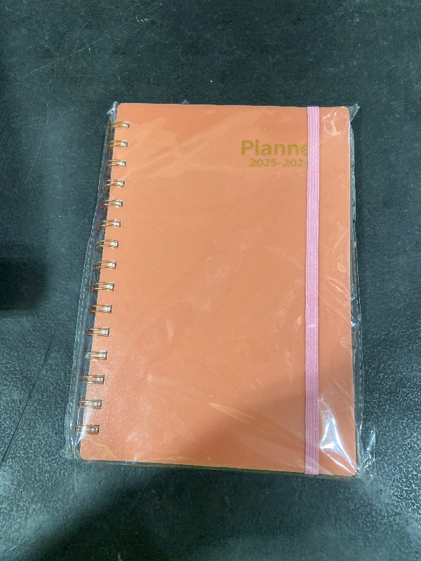 Photo 1 of Day Planner 2025-2026, Weekly & Monthly Planner from Jul 2025-Dec 2026, 18 Month Calendar Planner, Agenda 2025 with Tabs, A5 Size, Pink