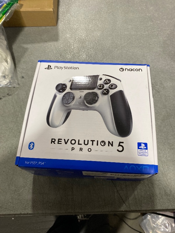 Photo 1 of NACON Revolution 5 Pro Officially Licensed PlayStation Wireless Gaming Controller for PS5 / PS4 / PC - Hall Effect, Trigger Stops, Mappable Buttons, Bluetooth Audio - White