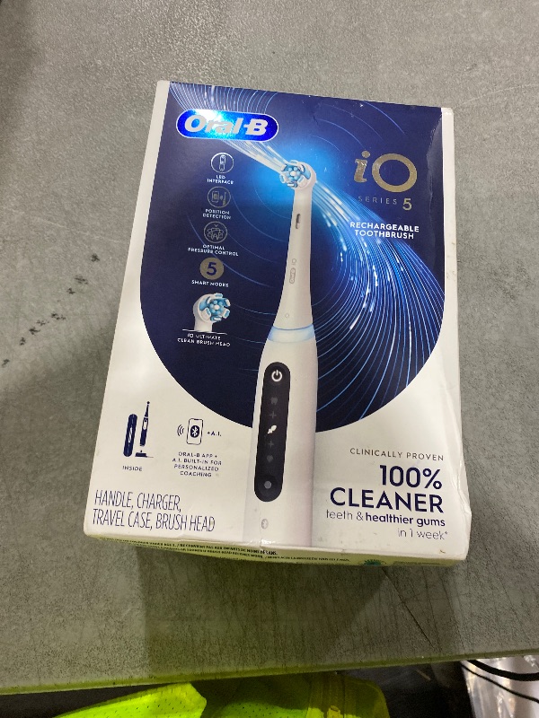 Photo 1 of Oral-B iO Series 5 Rechargeable Electric Toothbrush with Visible Pressure Sensor to Protect Gums, 2 Minute Timer, 5 Cleaning Settings, 1 Replacement Toothbrush Heads, and Travel Case, White