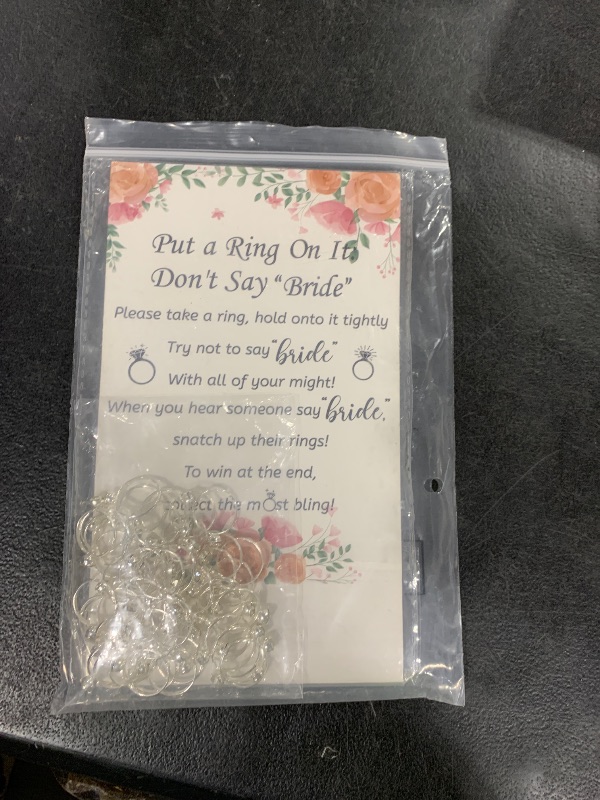 Photo 1 of Woanger Put a Ring on It Bridal Shower Game with 50 Fake Rings, Rustic Greenery Theme Wedding Shower Games Wedding and Engagement Rings and Not Say Bride Rules Cards(Flowers,Silver)