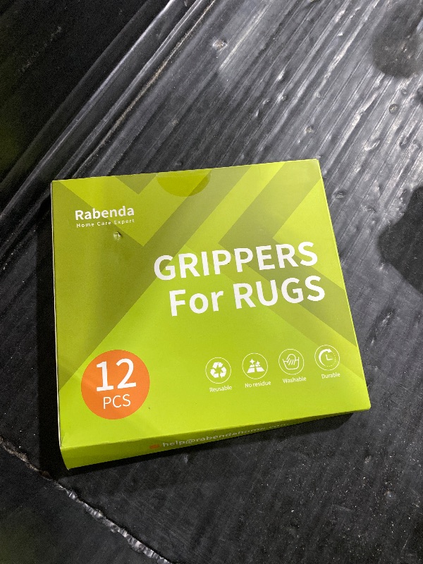 Photo 1 of Rabenda 12 Pcs Rug Tape, Non Slip Rug Pads Grippers for Hardwood Floors and Tiles, Reusable Carpet Tape for Area Rugs, Double-Sided Adhesive Rug Stickers Keep Corners Flat (Black)