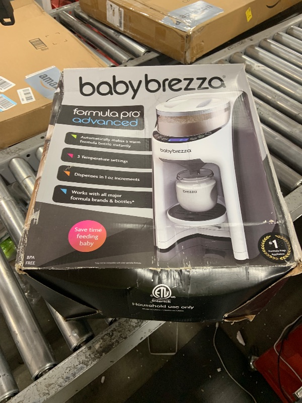 Photo 1 of Baby Brezza New and Improved Formula Pro Advanced Formula Dispenser Machine - Automatically Mix a Warm Formula Bottle Instantly - Easily Make Bottle with Automatic Powder Blending, White