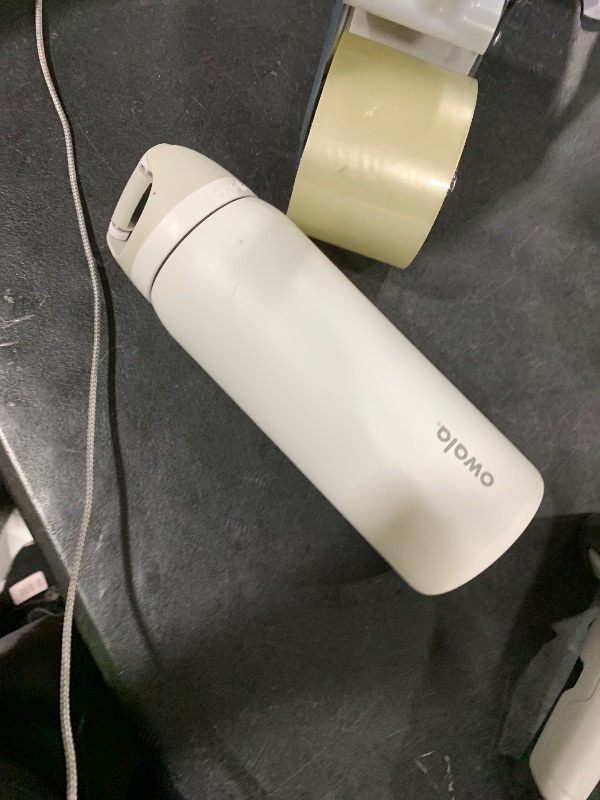 Photo 1 of Owala FreeSip Insulated Stainless Steel Water Bottle with Straw, BPA-Free Sports Water Bottle, Great for Travel, 32 Oz, Shy Marshmallow