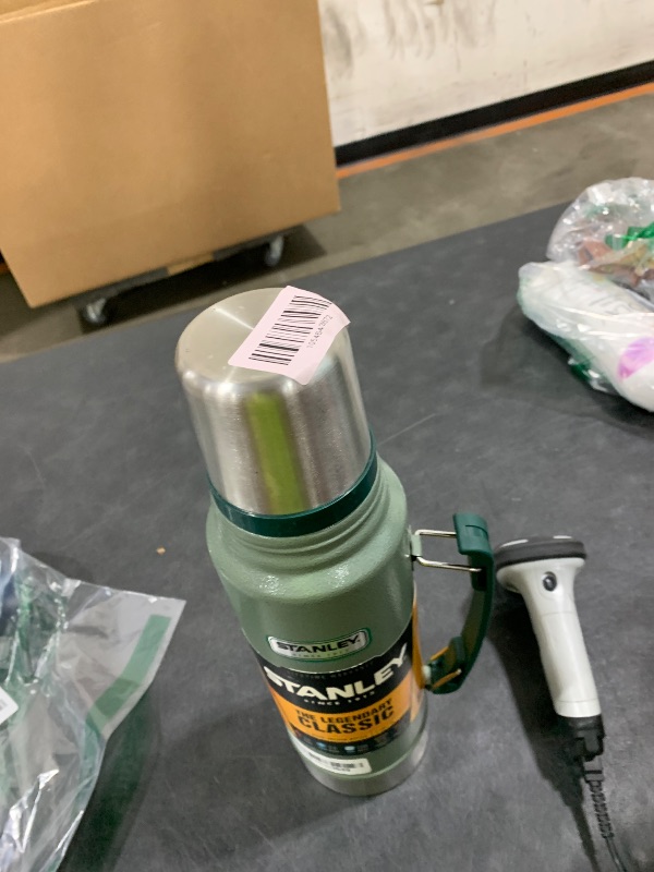 Photo 1 of Stanley Heritage Classic Vacuum Bottle with Handle 1.1 qt | Wide Mouth with Leakproof Cup Lid | Keep Drinks Hot or Cold for Travel | Insulated Stainless Steel Thermos | BPA-Free | Hammertone Green