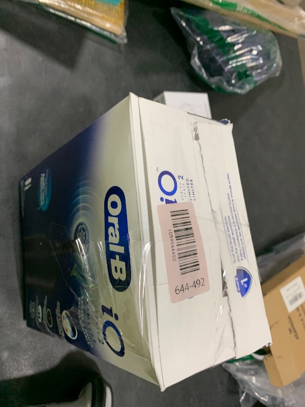 Photo 1 of Oral-B iO Simple Clean Rechargeable Electric Powered Toothbrush, Night Black with 1 Gentle Care Brush Head and 1 Black Travel Case - Automatic Pressure Sensor to Protect Gums - 3 Modes - 2 Min Timer