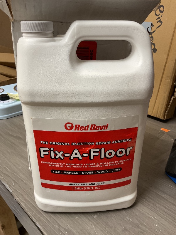 Photo 1 of Fix-A-Floor Tile Repair Adhesive – Extra Strength Adhesive for Tile, Marble, Stone, Wood - Easy DIY Repair – Versatile Compatibility - 1 Gallon Jug – Comes with a Syringe Applicator