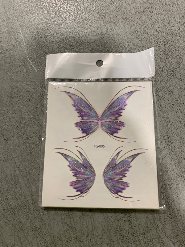 Photo 1 of 14 Sheets Glitter Butterfly Temporary Tattoos Sticker for Women Girls Eye Face Makeup Decoration, Flash Fairy Body Art Shiny Butterflies Waterproof Fake Tattoos for Festival Party Eye Decor