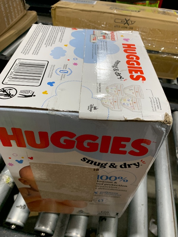 Photo 1 of Huggies Size 1 Diapers, Snug & Dry Newborn Diapers, Size 1 (8-14 lbs), 128 Count, Packaging May Vary