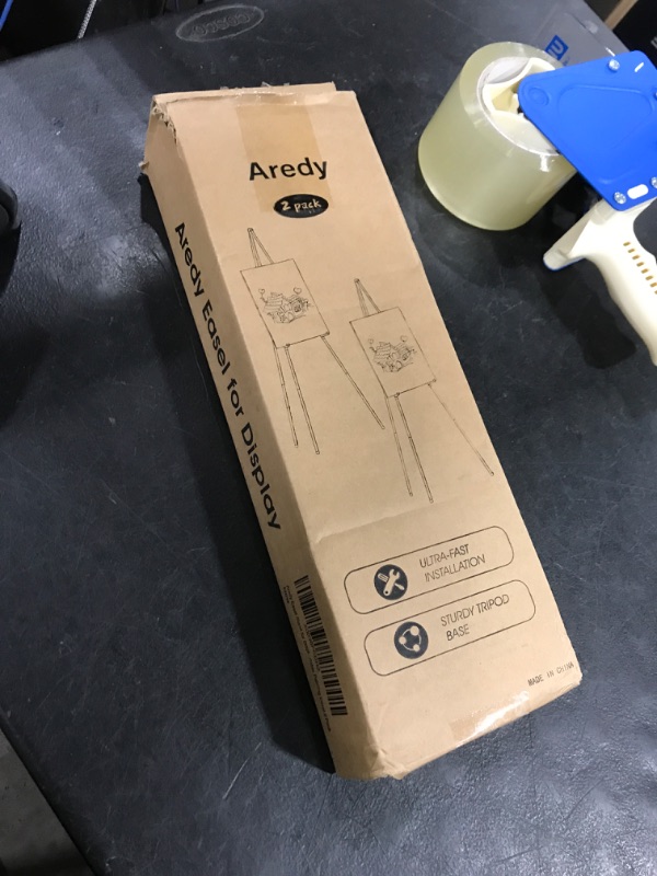 Photo 1 of Easel Stand for Sign, Aredy 63" Portable Painting Easel, Lightweight Metal Easels for Painting Canvas, Wedding Sign (2 Pack)