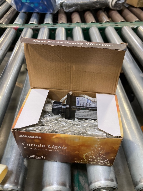 Photo 1 of JMEXSUSS 300 LED Remote Control Curtain Lights, Plug in Fairy Curtain Lights Outdoor, Window Wall Hanging String Lights for Bedroom Indoor Dorm Backdrop Wedding Party Patio Christmas Decor, Warm White