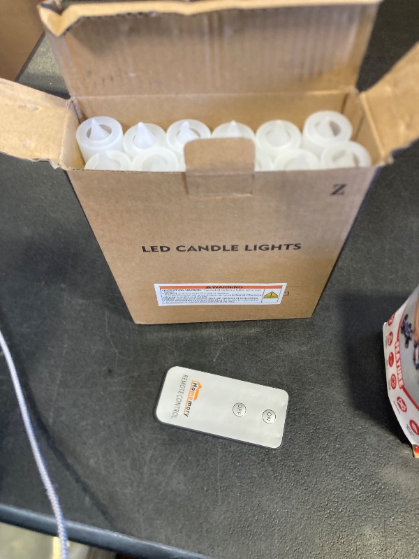 Photo 1 of Homemory LED Batteries Operated Taper Candles with Remote, Flickering Light Flameless Taper Window Candle, Set of 12 Warm Yellow Fake Candles for Halloween, Church, Party