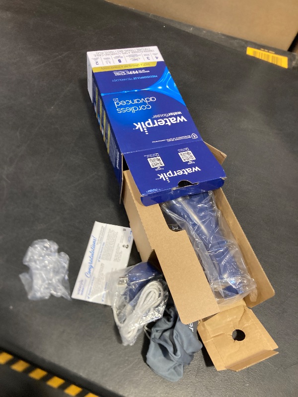 Photo 1 of Waterpik Cordless Advanced 2.0 Water Flosser For Teeth, Gums, Braces, Dental Care With Travel Bag and 4 Tips, ADA Accepted, Rechargeable, Portable, and Waterproof, Blue WP-583, Packaging May Vary