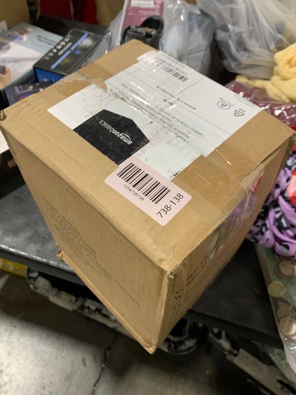 Photo 1 of Amazon Basics Oscillating Ceramic Space Heater, Portable Indoor Heating Solution, With Overheat and Tip-Over Protection, Thermostat, 1500W, 7.52"D x 6.34"W x 9.45"H, Black