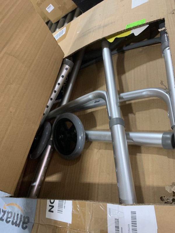 Photo 1 of Drive Medical Deluxe Two Button Folding Walker with 5" Wheels