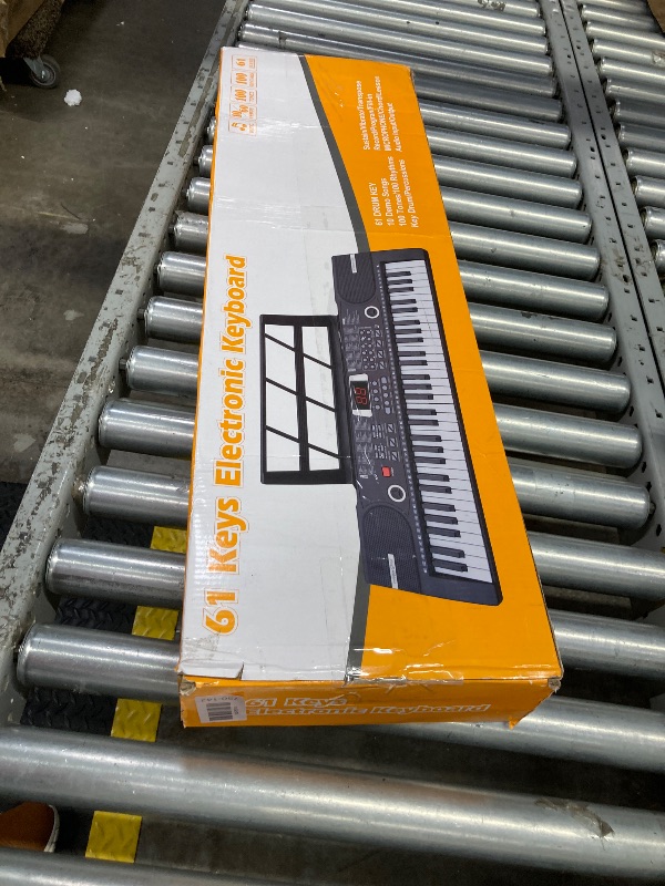 Photo 1 of **MISSING POWER CORD AND MICROPHONE**61 Keys Keyboard Piano, Electronic Digital Piano with Built-In Speaker Microphone, Sheet Stand and Power Supply, Portable Keyboard Gift Teaching for Beginners