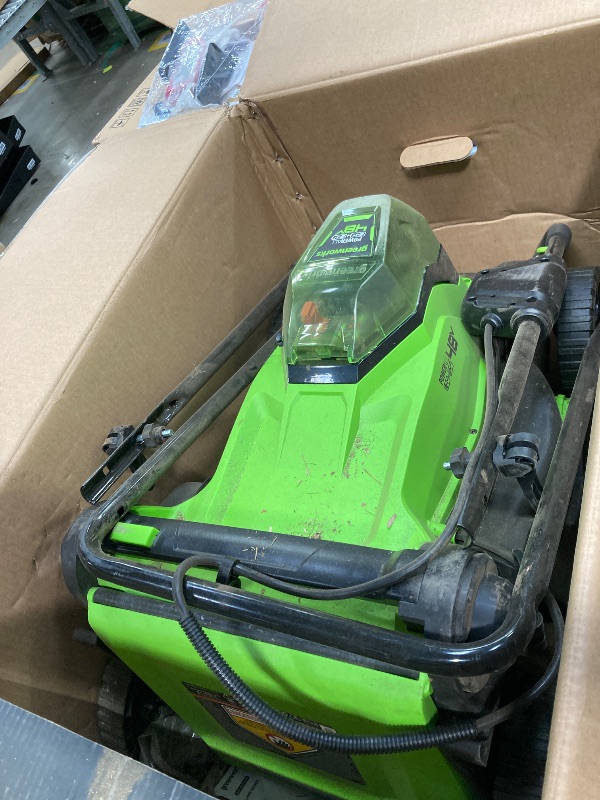 Photo 1 of *DIRTY* *Pieces may be missing* Greenworks 48V (2x24V) 17" Brushless Mower+12" String Trimmer +320CFM Blower,(2) 4.0Ah Batteries and 2A Dual Port Charger
