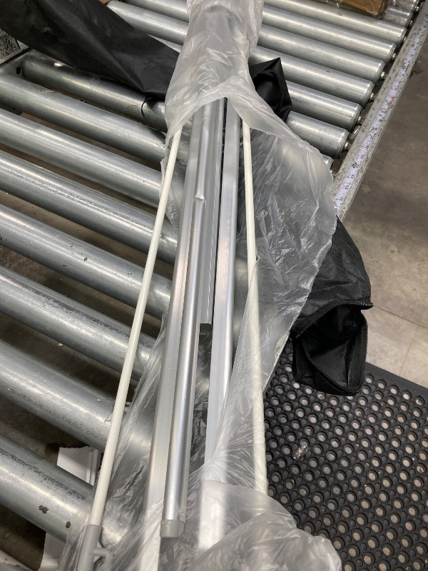 Photo 1 of **It is used and has some dents on the front stop**nley Adjustable X Banner Stand with Travel Bag - Fits Any Banner Size from 23" X 63" to 35" X 78" - Portable Retractable Stand for Business, Trade Shows, Events, and Displays (Banner Not Included)