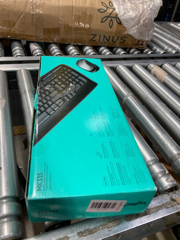 Photo 1 of **I DON'T KNOW IF THERE ARE MISSING PARTS*** *Logitech MK335 Quiet Wireless Keyboard and Mouse Combo - Black/Silver Keyboard and Mouse Combo Wireless, Ambidextrous