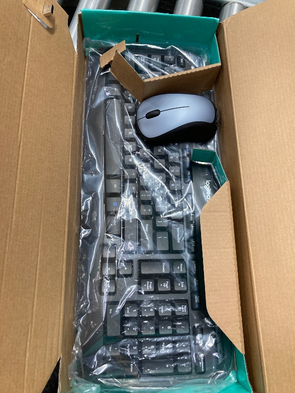 Photo 1 of **I DON'T KNOW IF THERE ARE MISSING PARTS*** *Logitech MK335 Quiet Wireless Keyboard and Mouse Combo - Black/Silver Keyboard and Mouse Combo Wireless, Ambidextrous