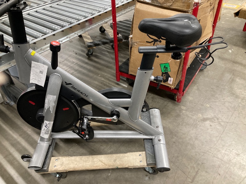 Photo 1 of ** is only to use for parts***MERACH Exercise Bike Brake Pad Stationary Bike with Exclusive App Low Noise Indoor Cycling Bike with 300lbs Weight Capacity Tablet Mount and Fitnes **USED**