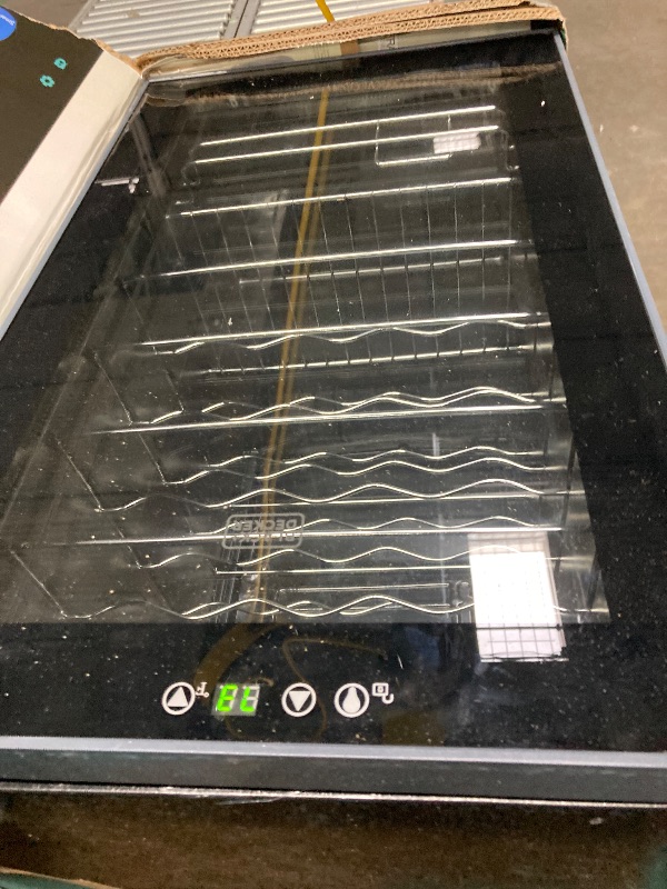 Photo 1 of ***NE SIDE OF THE DOOR IS DETACHED BECAUSE IT IS MISSING A SCREW**The product is used and was connected and turned on, but it is not known if it works at 100% because it has to be given time to cool down.BLACK+DECKER BD61526 Wine Cellar, Black Cabinet wit