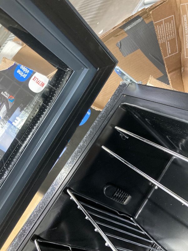 Photo 1 of ***NE SIDE OF THE DOOR IS DETACHED BECAUSE IT IS MISSING A SCREW**The product is used and was connected and turned on, but it is not known if it works at 100% because it has to be given time to cool down.BLACK+DECKER BD61526 Wine Cellar, Black Cabinet wit